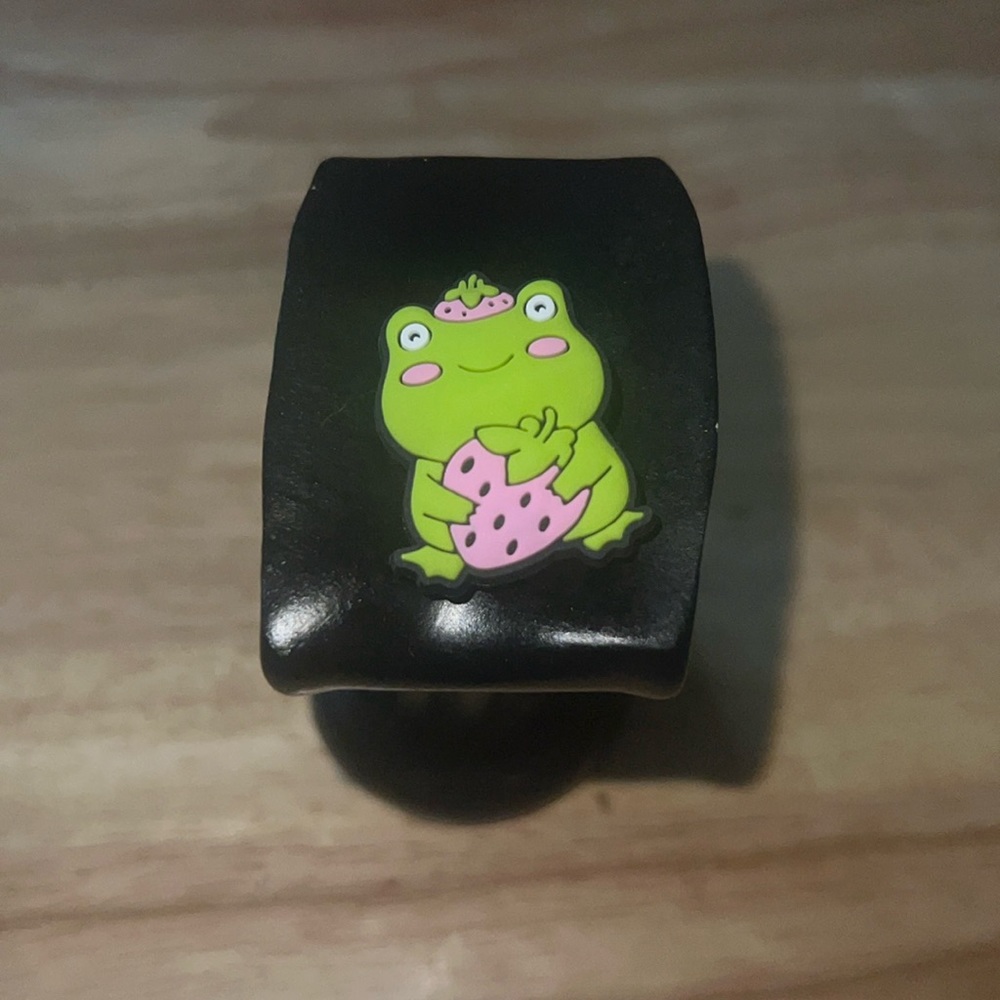 Frog with strawberry croc charm